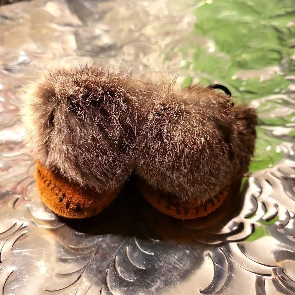 Moccasins,  real leather and real rabbit fur,  has a great insole! Size 8 child